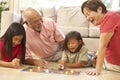 Grandparents And Grandchildren Playing Board Game Royalty Free Stock Photo