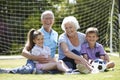 Grandparents And Grandchildren Playing Football In Garden Royalty Free Stock Photo