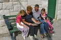 Grandparents with grandchildren watch a photo Royalty Free Stock Photo