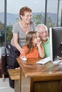 Grandparents and granddaughter with computer Royalty Free Stock Photo