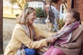 Grandparents With Granddaughter Outside House Getting Ready To Go For Winter Walk Royalty Free Stock Photo