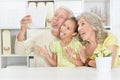 Grandparents with granddaughter taking selfie with tablet Royalty Free Stock Photo