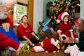 Grandparents and Grandkids Unwrap Christmas Presents Royalty Free Stock Photo