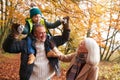 Grandparents With Grandson Enjoying Walk Along Autumn Woodland Path Together Royalty Free Stock Photo