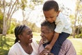 Grandparents And Grandson Having Fun In Park Together