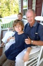 Grandparents with grandson on porch