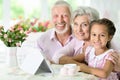 Grandparents with her granddaughter using tablet Royalty Free Stock Photo