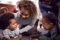 Grandparents At Home With Grandchildren Drawing Pictures In Lounge Together Royalty Free Stock Photo