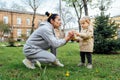 Grandparents in kids life, Grandparents teach children. Senior woman grandmother and little toddler girl playing outdoor Royalty Free Stock Photo