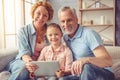 Grandparents and little girl at home Royalty Free Stock Photo