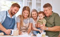 Grandparents, parents and kid baking, happy and being loving together in kitchen. Family, cooking and smile with Royalty Free Stock Photo