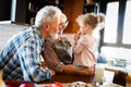 Grandparents playing and having fun with their granddaughter Royalty Free Stock Photo