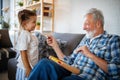 Grandparents playing and having fun with their granddaughter Royalty Free Stock Photo