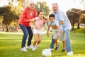 Grandparents Playing Soccer With Grandchildren In Park Royalty Free Stock Photo