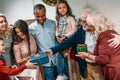 happy beautiful grandparents presenting christmas gifts Royalty Free Stock Photo