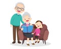 grandparents reading book with granddaughter Royalty Free Stock Photo