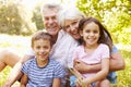 Grandparents sitting outdoors with their grandchildren Royalty Free Stock Photo