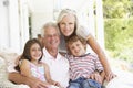 Grandparents Sitting Outisde with Grandchildren Royalty Free Stock Photo