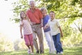 Grandparents walking with grandchildren Royalty Free Stock Photo