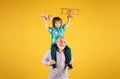 Grandson child and grandfather with toy plane and wooden toy truck. Men generation granddad and grandchild. Elderly old