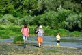 Grandson with father and grandfather fishing by lake. Old and young. Father and son fishing. Man in different ages. Royalty Free Stock Photo