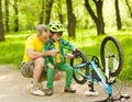 Grandson with his grandfather pumped wheel bicycle