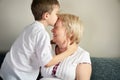 Grandson kissing his grandmother