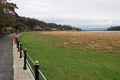 Promenade and Grassy Mudbanks on Seafront at Grange-over-Sands, Cumbria, England, UK Royalty Free Stock Photo