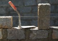 Granite blocks wall construction with mortar Royalty Free Stock Photo
