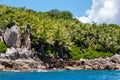 Granite coastline view of the tropical island of Marianne in Seychelles with blue sky