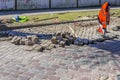 Granite cobblestone pavement repair in city street Royalty Free Stock Photo