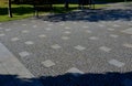 granite cobblestone tiles in a large area and inside cut irregularly