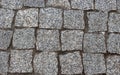 Granite cobblestoned pavement background. Cobbled stone road regular shapes, abstract background of old cobblestone pavement close Royalty Free Stock Photo