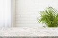 Granite countertop of several tones over white brick wall background Royalty Free Stock Photo