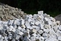 Granite cube bricks on the mound. Royalty Free Stock Photo