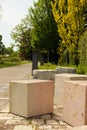 Granite cubes made for building. Geometric shape figures lying on the sidewalk