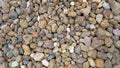 Granite gravel of macadam, Rock brown crushed for construction on the ground, Scree texture background.