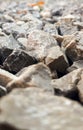 Granite gravel road texture. Natural crushed stone background. Grey  copy space surface with granite, gravel or rock Royalty Free Stock Photo