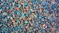 Granite gravel texture for design. Colorful stone texture: small sanded gravel. Small white, grey and blue chalk stones. Artistic Royalty Free Stock Photo