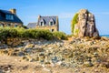 Granite houses and boulder in the harbor of Pors Hir in Brittany, France