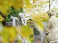 Granite male and female statues secure tombstones.   Detail in public graveyard Royalty Free Stock Photo