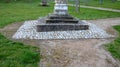 Granite natural paving of irregular shape, brown gray paving in the pedestrian zone in park near the bridge with stairs. garden pa