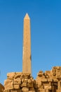 Granite obelisk against blue sky in a Karnak temple. Luxor, Egypt