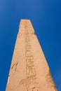 Granite obelisk against blue sky in a Karnak temple. Luxor, Egypt