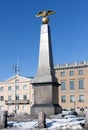 Granite obelisk with two headed golden eagle of the Empress Alexandra on Market Square in Helsinki, Finland