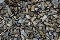 Granite pebbles background. Small granite debris forming a rocky surface.