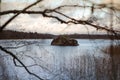 granite rock on the lake, lake in the Finland. Blue sky with clouds and autumn forest trees.