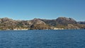 Granite rock slope with trees along a fjord Royalty Free Stock Photo