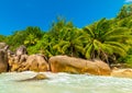 Granite rocks and palm trees by the sea in Anse Lazio Royalty Free Stock Photo