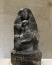 Granite sculpture Senenmut holding Hatshepsut`s daughter Neferura on display in the NMEC, Cairo, Egypt.